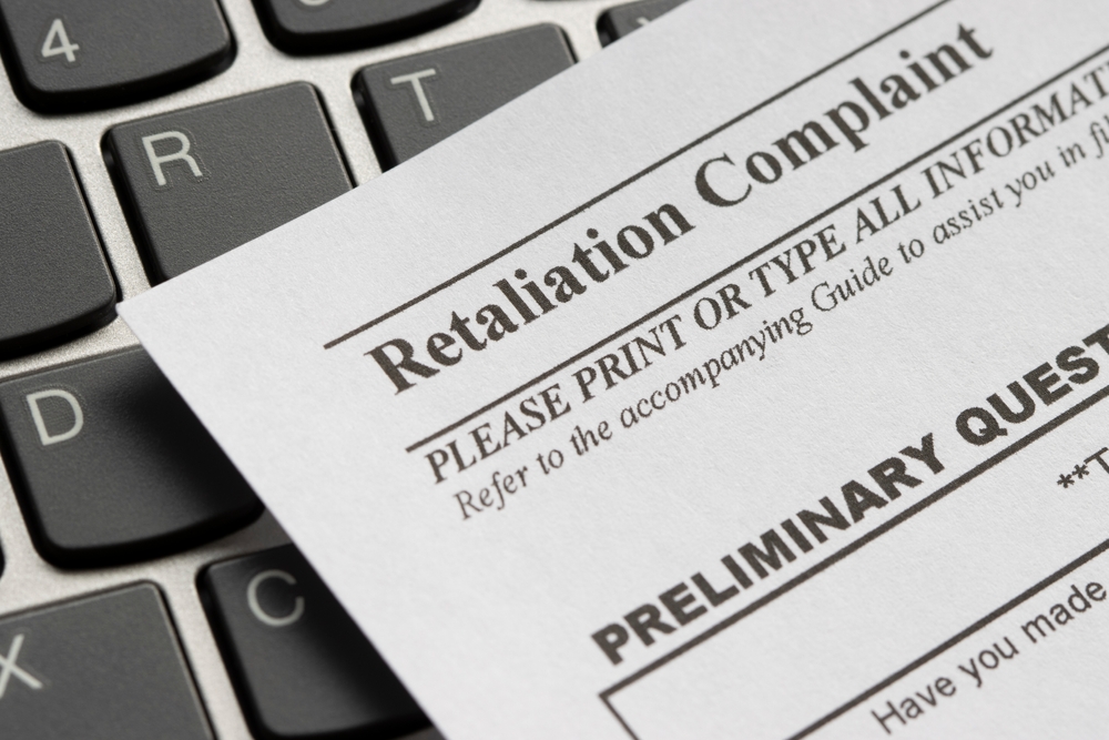 Formal Retaliation Complaint document on a keyboard